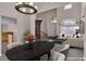 Dining area with dark wood table and chairs with tile floors at 1717 Double Arch Ct, Las Vegas, NV 89128