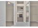 Hallway view leads to living area with fireplace and closet with mirrored sliding doors at 1717 Double Arch Ct, Las Vegas, NV 89128