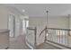 Hallway with a grey staircase and carpeted floors, and neutral paint at 1717 Double Arch Ct, Las Vegas, NV 89128