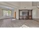Spacious room with entertainment center, tile floors and natural light at 1717 Double Arch Ct, Las Vegas, NV 89128