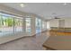 Bright open-concept living space with large windows providing natural light and views of the outdoor pool at 1717 Double Arch Ct, Las Vegas, NV 89128