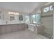 Luxurious main bathroom with double vanity, freestanding tub, and glass-enclosed shower at 1717 Double Arch Ct, Las Vegas, NV 89128