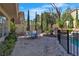 Outdoor patio with dining set, bordering the pool and lush foliage at 1717 Double Arch Ct, Las Vegas, NV 89128