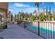 Inviting backyard pool with black metal safety fence and ample patio seating at 1717 Double Arch Ct, Las Vegas, NV 89128