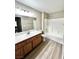 Bathroom with a well-lit vanity and a shower-tub combination at 1881 W Alexander Rd # 1128, North Las Vegas, NV 89032
