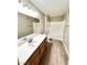 Bathroom features a single sink vanity, a large mirror and a shower over tub at 1881 W Alexander Rd # 1128, North Las Vegas, NV 89032