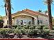 Community clubhouse surrounded by lush landscaping, creating a welcoming atmosphere at 1881 W Alexander Rd # 1128, North Las Vegas, NV 89032