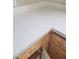 Close-up of white countertops with wooden cabinets at 1881 W Alexander Rd # 1128, North Las Vegas, NV 89032