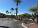 Gated community entrance featuring lush trees and landscaping providing privacy and security at 1881 W Alexander Rd # 1128, North Las Vegas, NV 89032