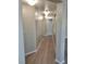 Hallway with modern lighting and wood-look flooring at 1881 W Alexander Rd # 1128, North Las Vegas, NV 89032