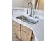 Stainless steel kitchen sink with modern fixtures and white countertops at 1881 W Alexander Rd # 1128, North Las Vegas, NV 89032