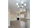 Open living space with modern lighting, fireplace, and large window at 1881 W Alexander Rd # 1128, North Las Vegas, NV 89032