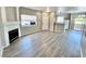 Open living room featuring hard surface floors, a fireplace, and plenty of natural light at 1881 W Alexander Rd # 1128, North Las Vegas, NV 89032