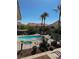 Relaxing community pool and spa surrounded by lush landscaping and comfortable lounge chairs for residents at 1881 W Alexander Rd # 1128, North Las Vegas, NV 89032