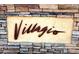 Stone community sign adds charm, showcasing the entrance to Villagio at 1881 W Alexander Rd # 1128, North Las Vegas, NV 89032