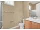 Bright bathroom featuring a glass-enclosed shower, neutral tile, and updated fixtures at 2318 Shorewood Hills Ave, Henderson, NV 89052