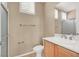 Bright bathroom featuring a glass-enclosed shower, neutral tile, and updated fixtures at 2318 Shorewood Hills Ave, Henderson, NV 89052
