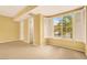 Well lit bedroom featuring neutral carpet, and a large window at 2318 Shorewood Hills Ave, Henderson, NV 89052