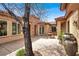 Relaxing courtyard showcasing a stone fountain, lush greenery and stylish architectural details at 2318 Shorewood Hills Ave, Henderson, NV 89052