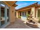 Inviting courtyard with a decorative fountain and double-door entrance at 2318 Shorewood Hills Ave, Henderson, NV 89052