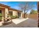 Charming courtyard featuring a fountain, mature landscaping and an outdoor living space at 2318 Shorewood Hills Ave, Henderson, NV 89052