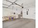 Spacious garage with ample storage racks, overhead door and epoxy floor at 2318 Shorewood Hills Ave, Henderson, NV 89052