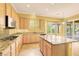 Well-appointed kitchen with granite countertops, center island, and stainless steel appliances at 2318 Shorewood Hills Ave, Henderson, NV 89052