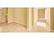 Spacious living area with tile flooring, neutral paint, and archway to other rooms at 2318 Shorewood Hills Ave, Henderson, NV 89052