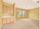 Spacious living room featuring a bar area and several windows at 2318 Shorewood Hills Ave, Henderson, NV 89052