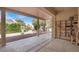 Spacious covered patio perfect for outdoor entertaining, with views of the landscaped backyard and blue skies at 2318 Shorewood Hills Ave, Henderson, NV 89052