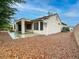 Quaint backyard features a covered patio area and low maintenance landscaping at 2557 Terrytown Ave, Henderson, NV 89052