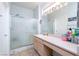 Practical bathroom with a shower, vanity, and well-lit mirror at 2557 Terrytown Ave, Henderson, NV 89052