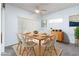 Sunlit dining room featuring a modern table setting and stylish decor at 2557 Terrytown Ave, Henderson, NV 89052