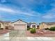 Charming single-story home with a well-maintained front yard and two-car garage at 2557 Terrytown Ave, Henderson, NV 89052