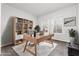 Bright home office with modern desk, shelving, and ample natural light at 2557 Terrytown Ave, Henderson, NV 89052
