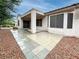 Covered patio with stone pavers, offering a great outdoor space for entertaining at 2557 Terrytown Ave, Henderson, NV 89052