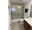 Bathroom featuring a shower with sliding glass doors and a sleek vanity at 2704 Otter Creek Ct # 101, Las Vegas, NV 89117
