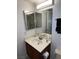 Bathroom with a vanity cabinet, sink, mirror, and overhead lighting at 2704 Otter Creek Ct # 101, Las Vegas, NV 89117