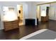Bedroom featuring wood floors, closet, and an ensuite bathroom at 2704 Otter Creek Ct # 101, Las Vegas, NV 89117