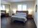 Cozy bedroom with wood floors and a mirrored closet at 2704 Otter Creek Ct # 101, Las Vegas, NV 89117