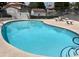 Enjoy a refreshing dip in the community pool with tiled trim at 2704 Otter Creek Ct # 101, Las Vegas, NV 89117
