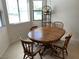The dining area has natural light and a round wooden dining table at 2704 Otter Creek Ct # 101, Las Vegas, NV 89117