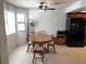 Bright dining area with a round table, a ceiling fan, and a window at 2704 Otter Creek Ct # 101, Las Vegas, NV 89117