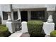 Exterior shot of a condo featuring a well-kept courtyard and architectural details like a stucco finish at 2704 Otter Creek Ct # 101, Las Vegas, NV 89117