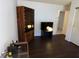 Well-lit living room showcasing laminate floors and featuring both a display cabinet and media center at 2704 Otter Creek Ct # 101, Las Vegas, NV 89117