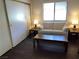 Cozy living room with laminate floors, a comfortable sofa, and natural light from the window at 2704 Otter Creek Ct # 101, Las Vegas, NV 89117