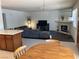 Bright open-concept living space featuring a fireplace, media center, and open access to the kitchen and dining area at 2704 Otter Creek Ct # 101, Las Vegas, NV 89117