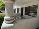 Exterior condo patio with a table, chairs, and decorative stucco columns at 2704 Otter Creek Ct # 101, Las Vegas, NV 89117