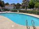 Sparkling community pool surrounded by lush landscaping and comfortable seating at 2704 Otter Creek Ct # 101, Las Vegas, NV 89117