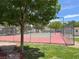 Community tennis court surrounded by shady trees at 2704 Otter Creek Ct # 101, Las Vegas, NV 89117